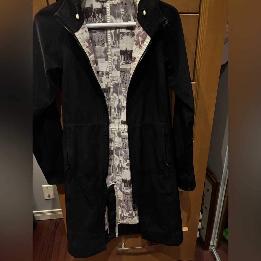 Lululemon Black  rain Coat with lVintage stamped LULU covering the entire coat